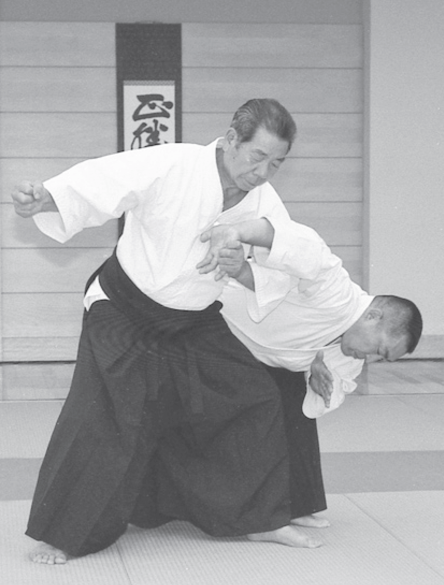 Morihiro Saito Sensei performing sankyo technique
